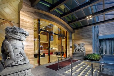 Sherwood Suites Saigon's Entrance with two stone guardian lion