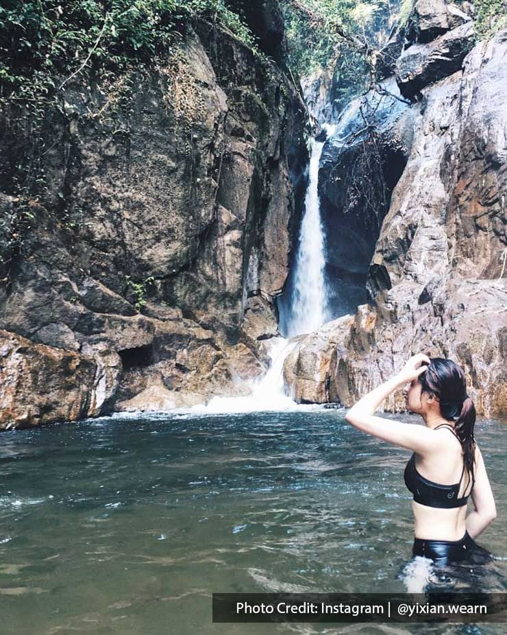 A woman was striking a pose near the Chiling Waterfalls - Lexis Suites Penang