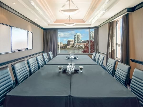 Table set up for meeting with view of marina