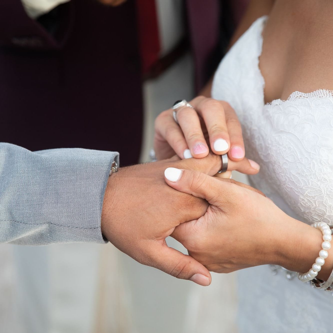 Close-up of bride & groom ring ceremony at True Blue Bay Resort