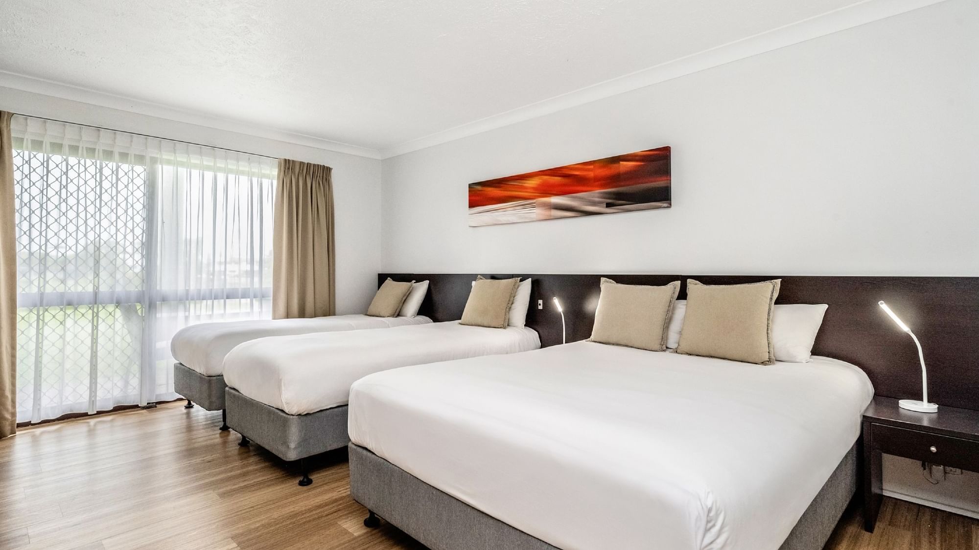 Family Room with a Queen and two Single beds is the  ideal accommodation for your Townsville family vacationily v