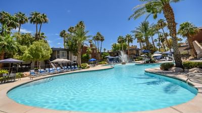 View of the outdoor swimming pool area & lounge at Alexis Park Resort