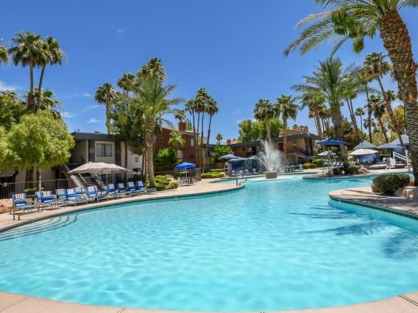 View of the outdoor swimming pool area & lounge at Alexis Park Resort