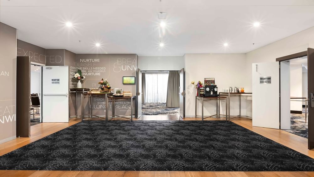 Pre-function area with modern decor and refreshments in The Barossa Room at Novotel Sydney on Darling Harbour