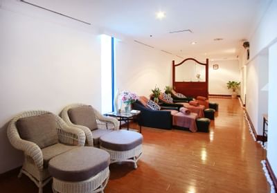 Wicker chairs and spa beds in a Spa at Hanoi Daewoo Hotel