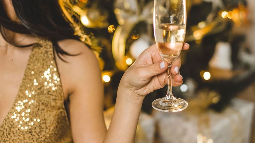 Woman holding a Champaign glass in the End of Year Christmas Party held at Hotel Grand Chancellor Hobart