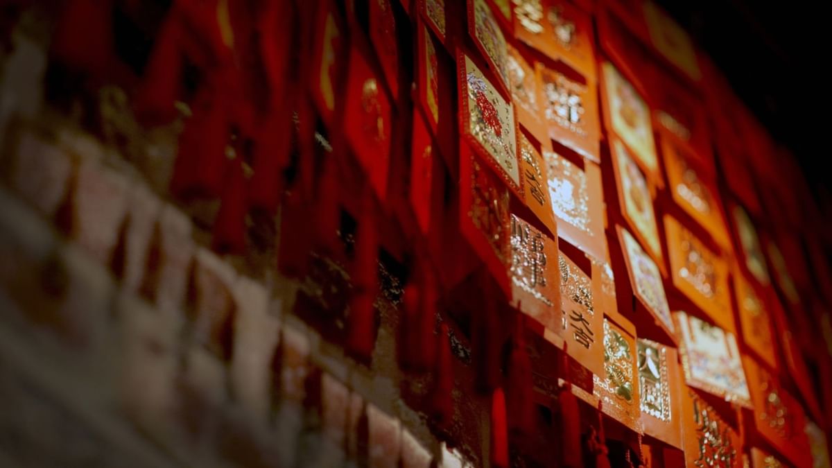 Wall of red Chinese New Year decorations in 88 Noodle Bar at Crown Hotels
