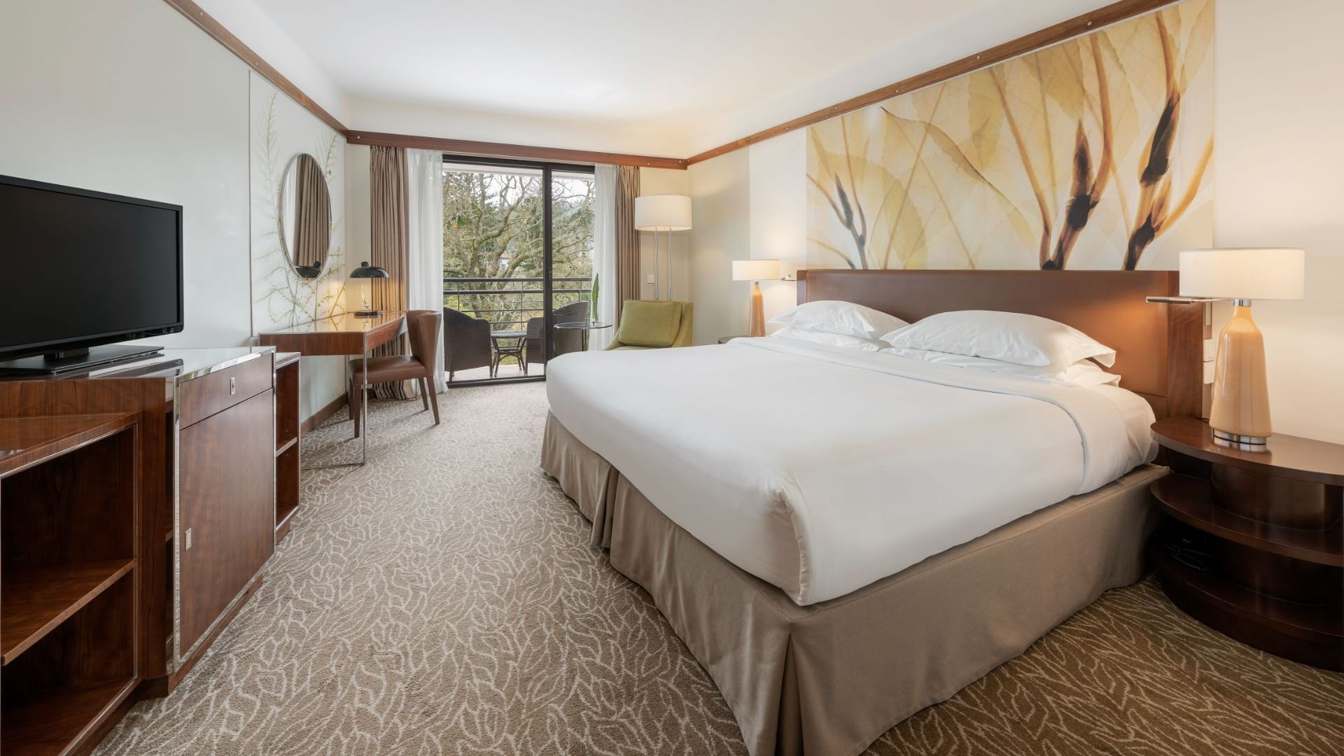 Large bed, bedside lamps, work desk, TV & balcony in Superior Garden View Room at Terra Nostra Garden Hotel