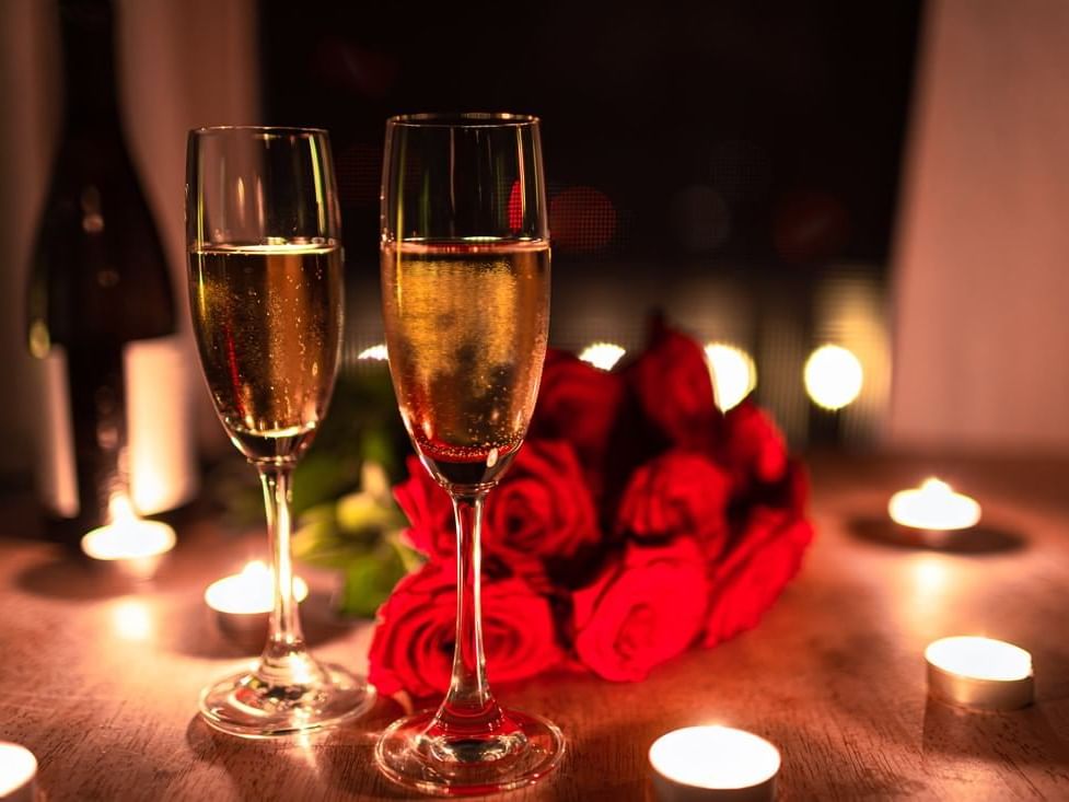 Champagne & red roses in candle light at MCM Eleganté Suites