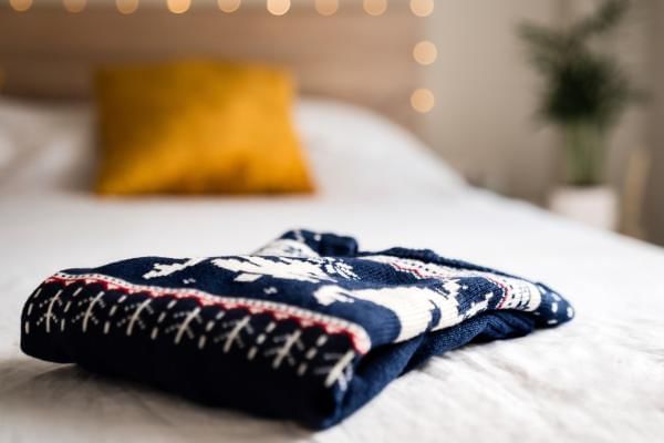 Christmas jumper on bed ready for Christmas Jumper Day