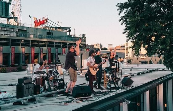 Band performing a rooftop concert on top of The Verb Hotel
