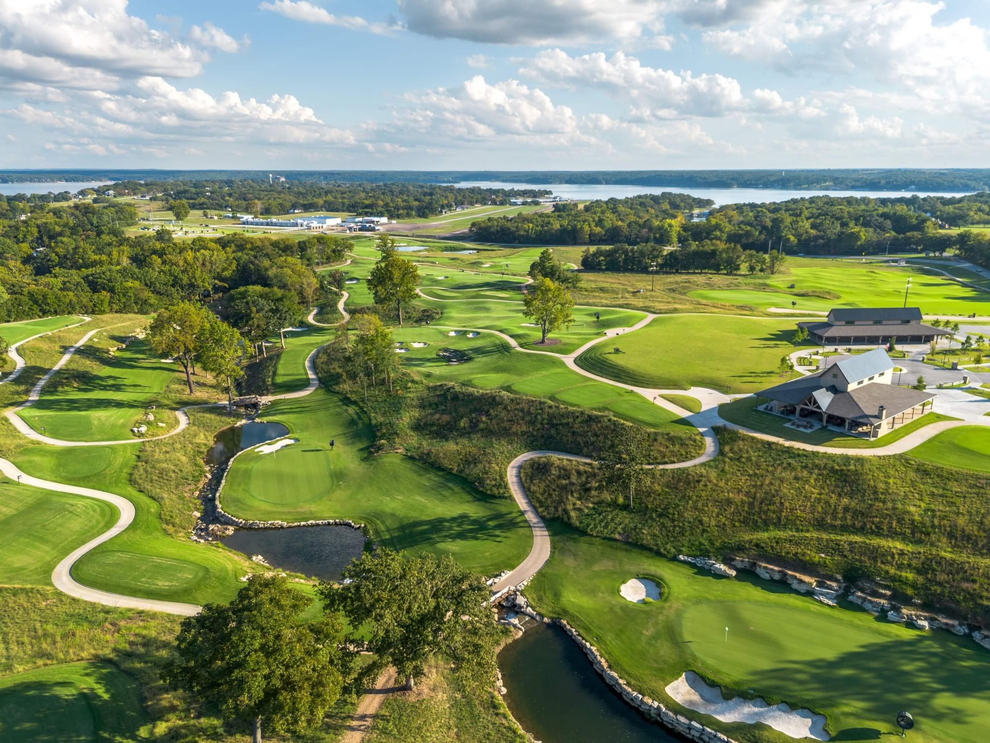 Aerial view of Legends Nine golf course with a lake at Shangri-La Resort