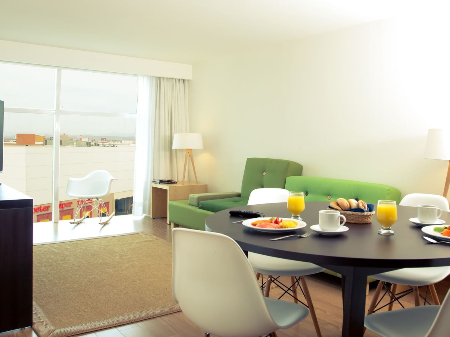 Living & dining area in Junior king suite at Fiesta Inn Hotels