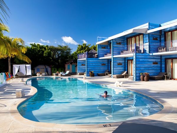 Outdoor pool area & Hotel exterior at True Blue Bay Resort