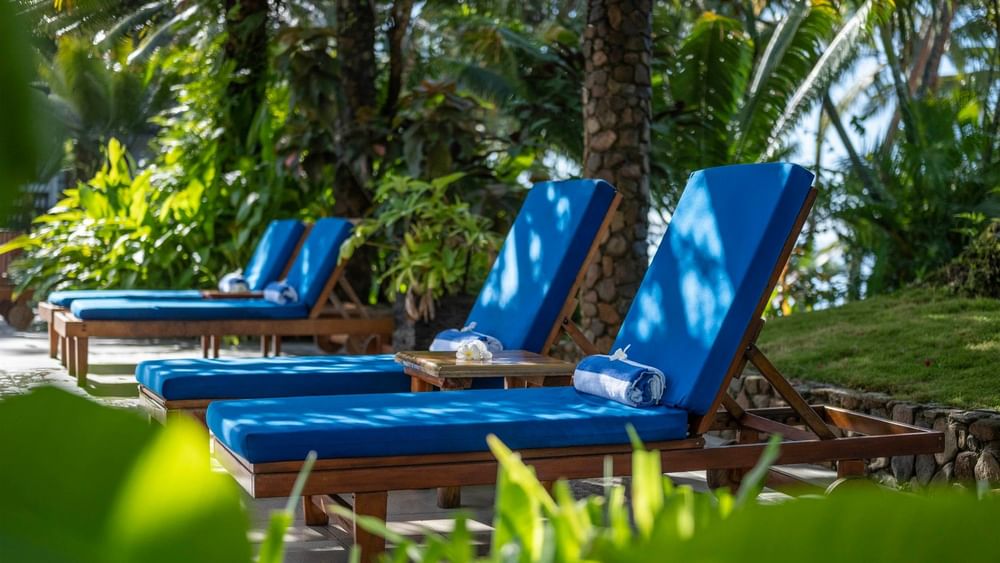 Blue sun loungers by the adult only pool at Warwick Fiji Resort and Spa Korolevu.