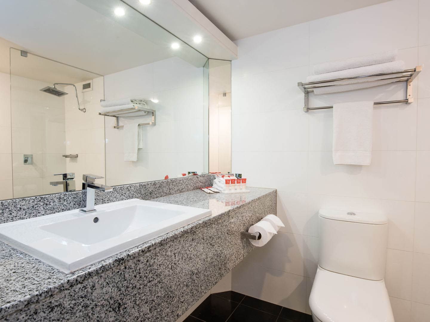 Bathroom lavatory by the vanity in Executive Queen Room at Grand Chancellor Adelaide