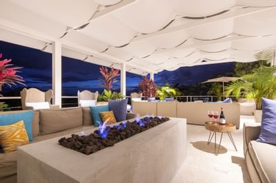Lounge area with sofas and a fireplace at Retreat Costa Rica