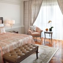 King bed, couch & TV in Deluxe Versace Room at Palazzo Versace