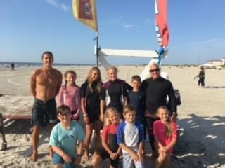A large group poses for a photo on the beach at our Wildwood Crest NJ hotel