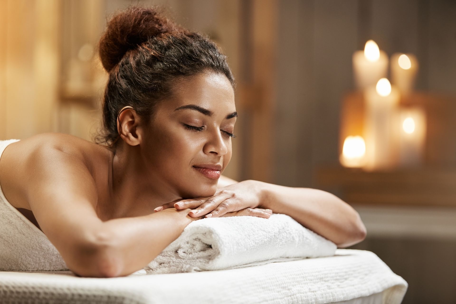 Close-up of a woman lying down on a massage table for a relaxing treatment in the spa at El Conquistador Resort