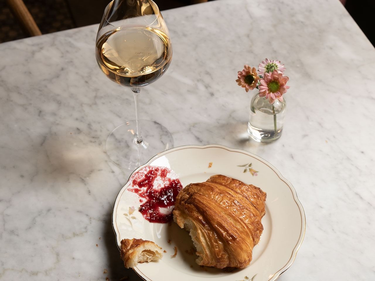 Croissant served with a side of jam & white wine at The Sparrow Hotel
