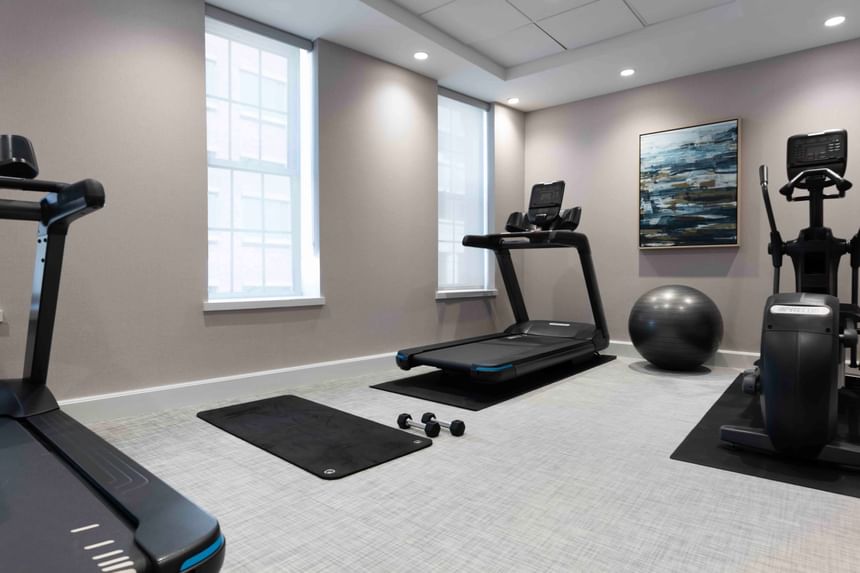 Gym room with various exercise equipment at Portland Harbor Hotel