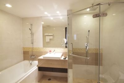 Bathtub, sink and shower in Neo Superior Room at Amora Neoluxe Hotel Bangkok