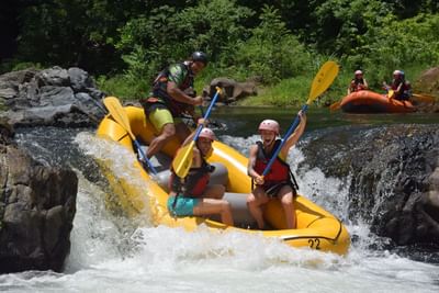 People enjoying rafting on a river near Villas Sol Beach Resort