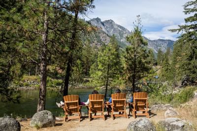 Guests lounging & overlooking the river near the Sleeping Lady
