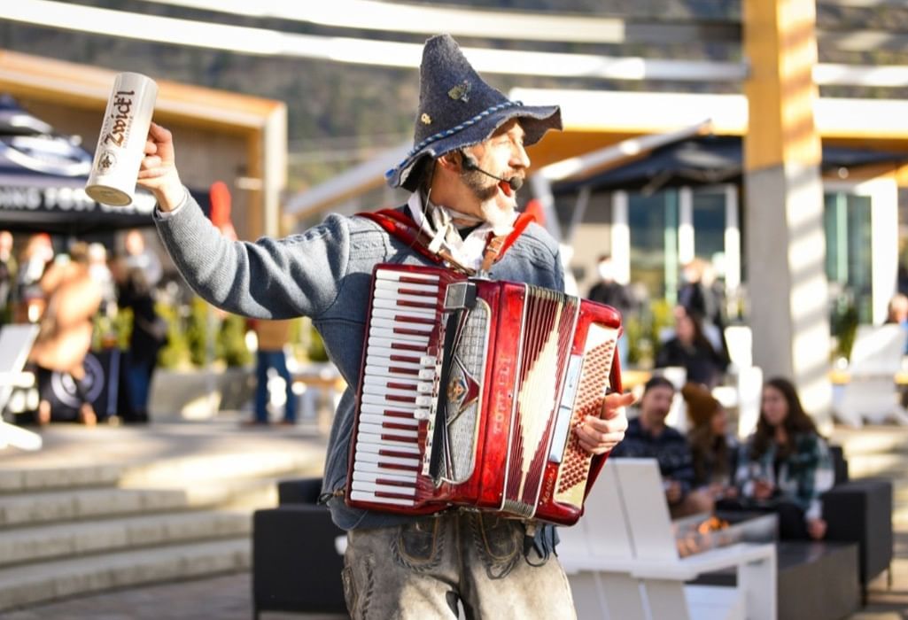  man playing the accordion dressed for oktoberfest