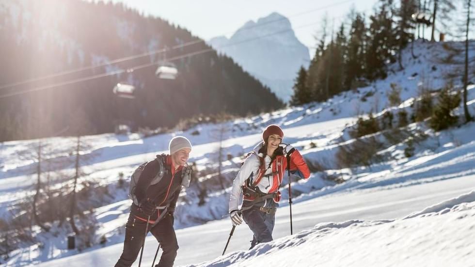 Couple ski touring in a snowy landscape near Falkensteiner Hotels and Residences