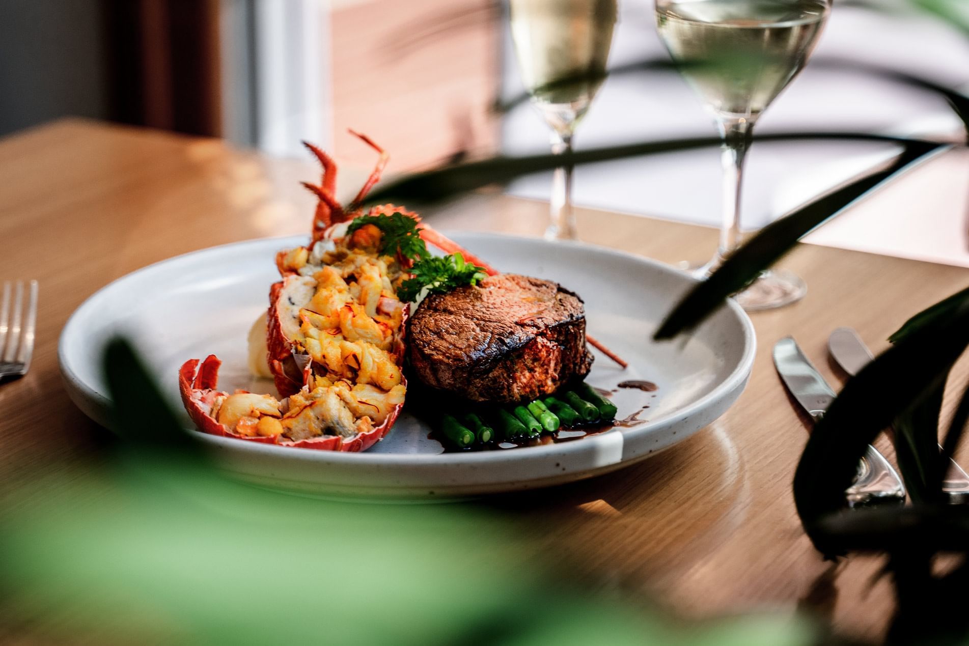 Steak & lobster dish in Coco's Kitchen + Bar at Pullman Cairns