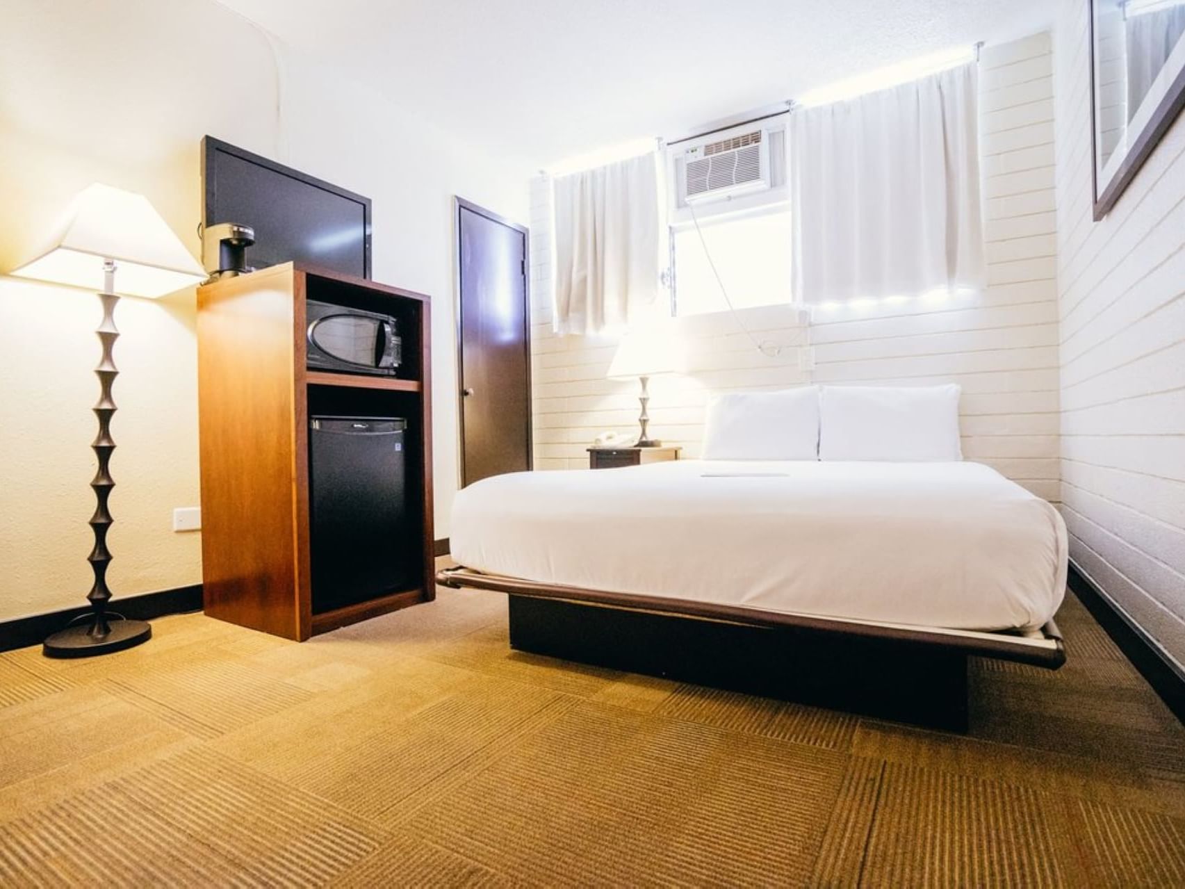 Large bed & mini fridge in Boutique Queen at Stay Hotel Waikiki