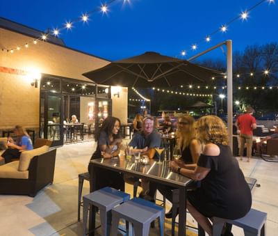 people stting in patio area at night