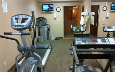 Exercise machines in the Fitness Room at Hotels in Fort Mcmurray, Franklin Suite Hotel