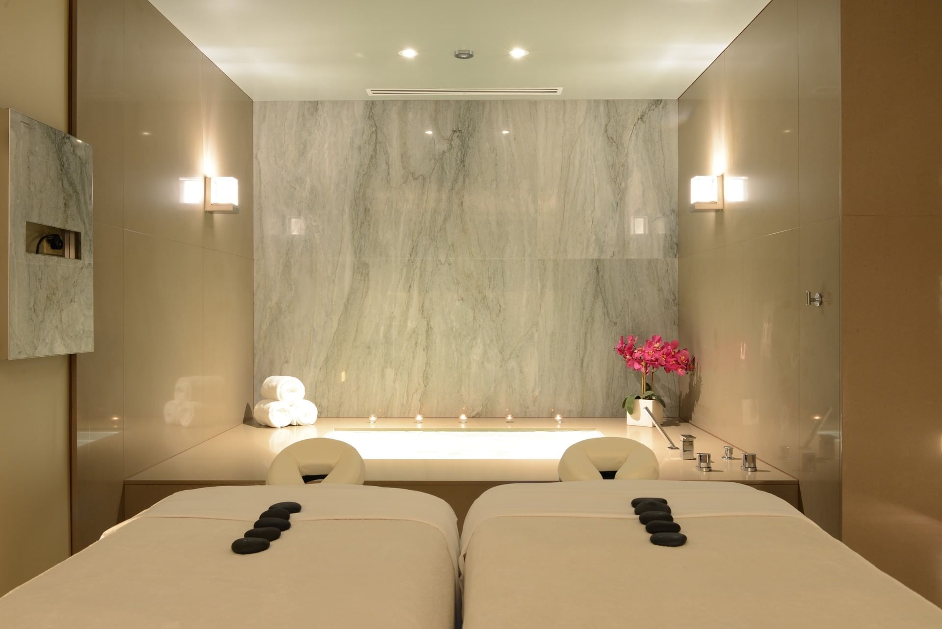 Zen stones on a spa bed in Treatment Room at Ocean Place