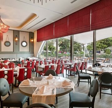 Dining area with banquets set in Parkfora Main Restaurant at Titanic Deluxe Lara