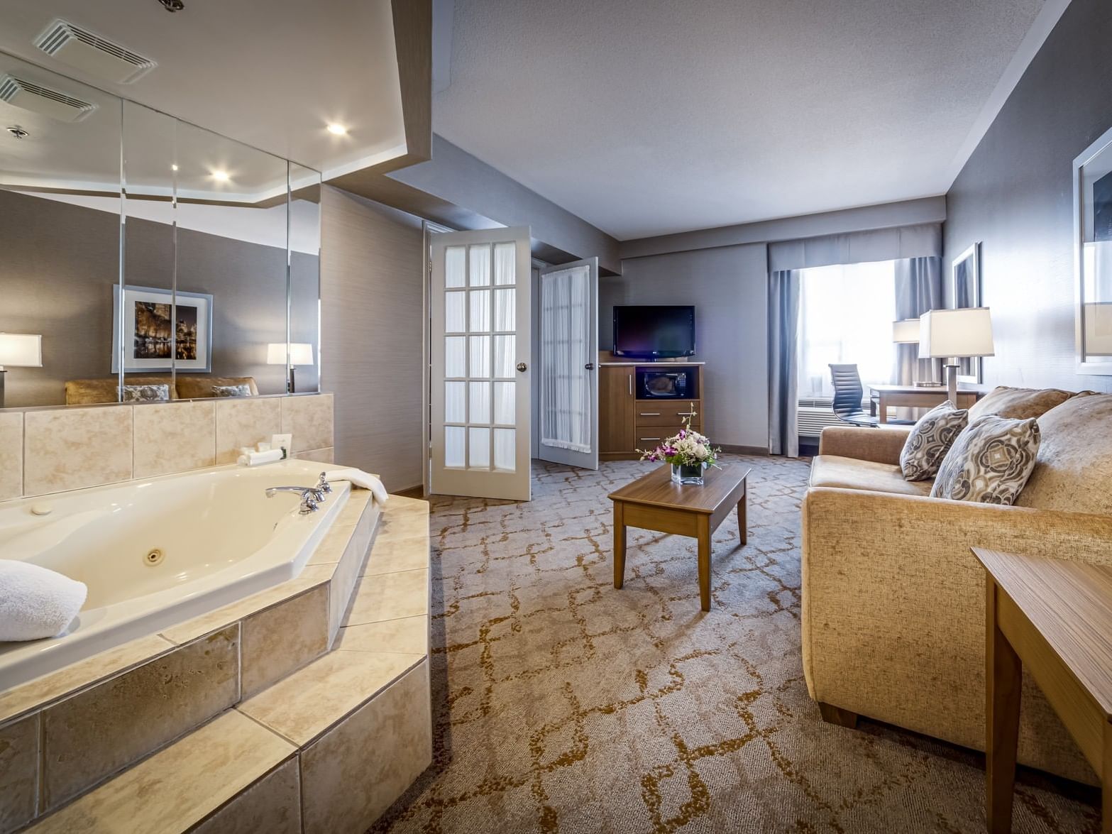 Deluxe King Jacuzzi Suite living room at Monte Carlo Inn Vaughan Suites