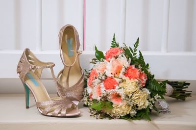 A flower bouquet & pair of shoes at Bougainvillea Barbados