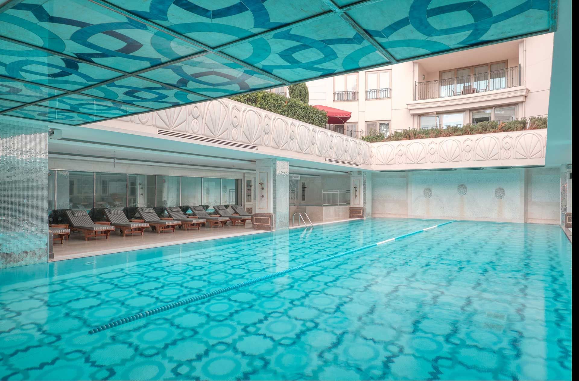 Calming interior view of pool with lounges at CVK Hotels