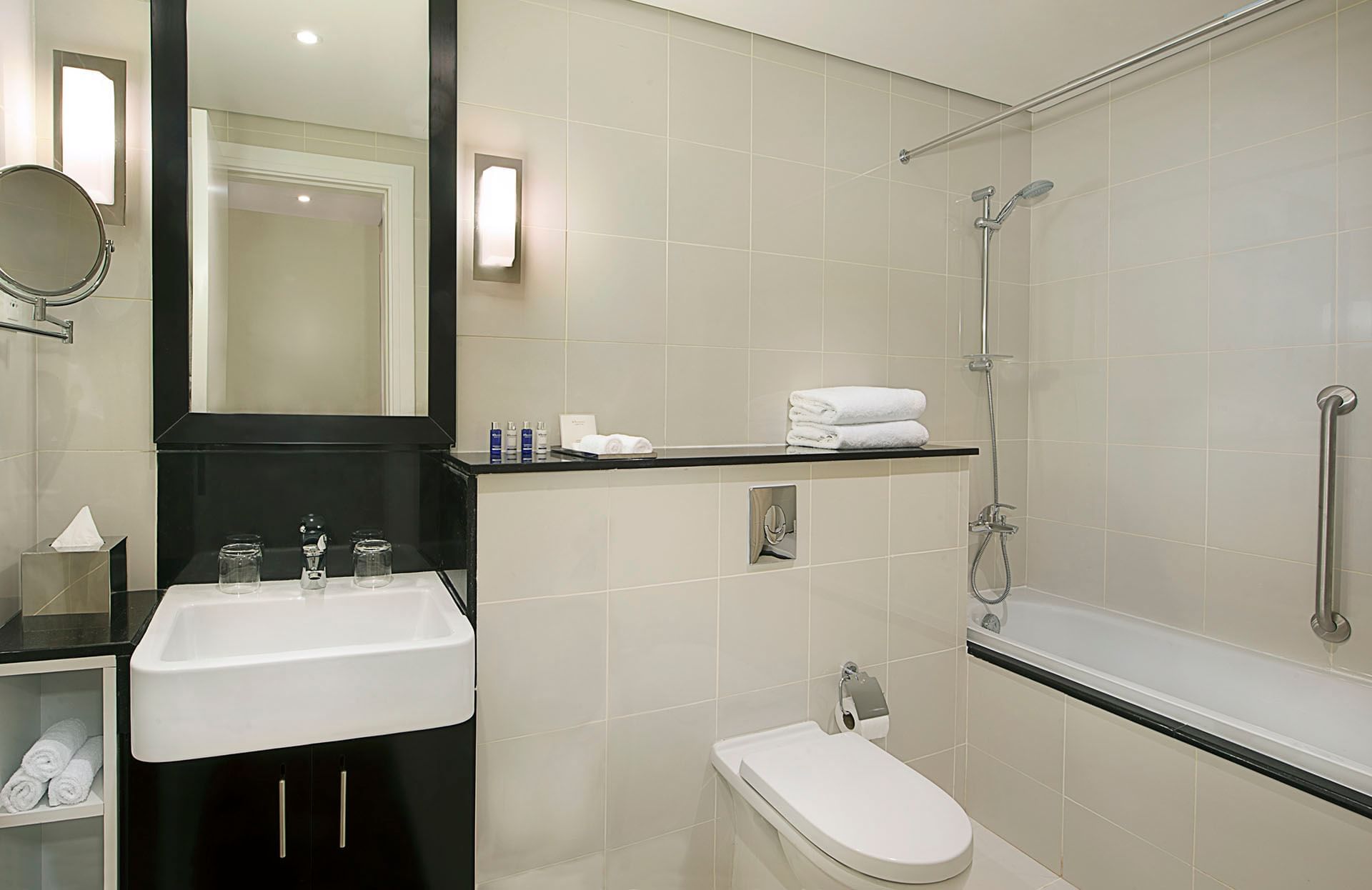 Modern bathroom with a sink, toilet, and shower in Two Bedroom Suite at DAMAC Maison Cour Jardin