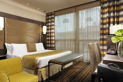 Bed & furniture in double Superior at Uptown Palace in Milan