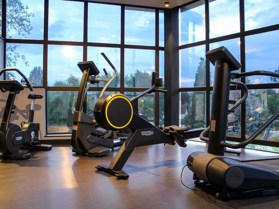 Workout machines in Gymnasium at The Originals Hotels