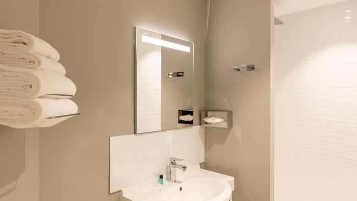 Bathroom vanity in bedrooms at Hotel Acadine
