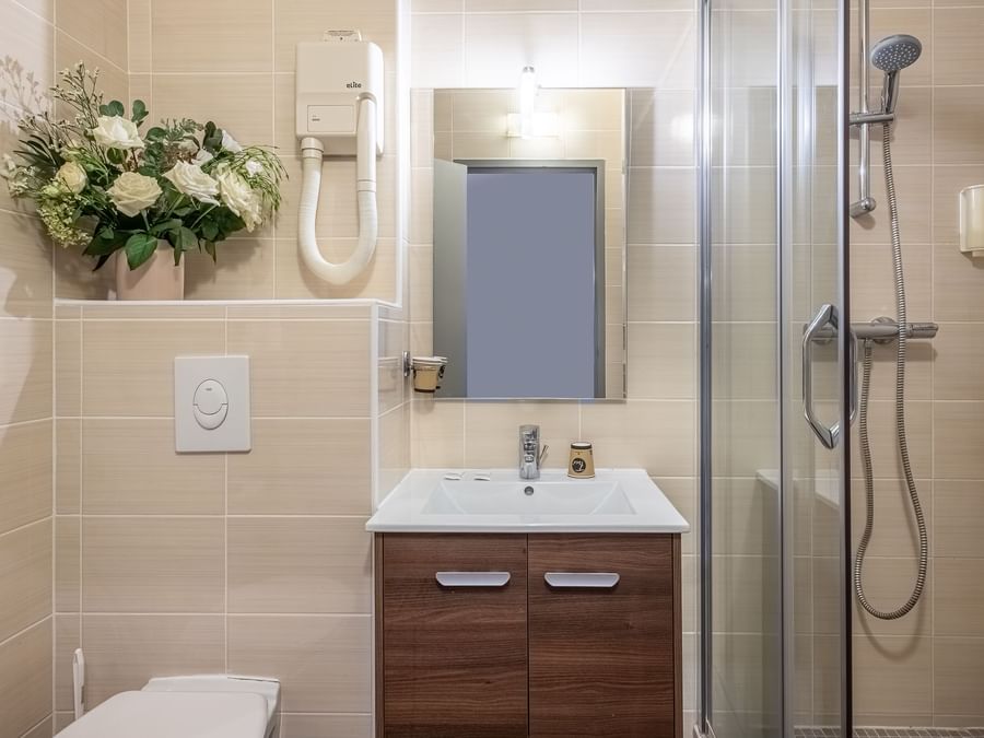 Bathroom vanity in Hotel Causse Comtal at The Originals Hotels