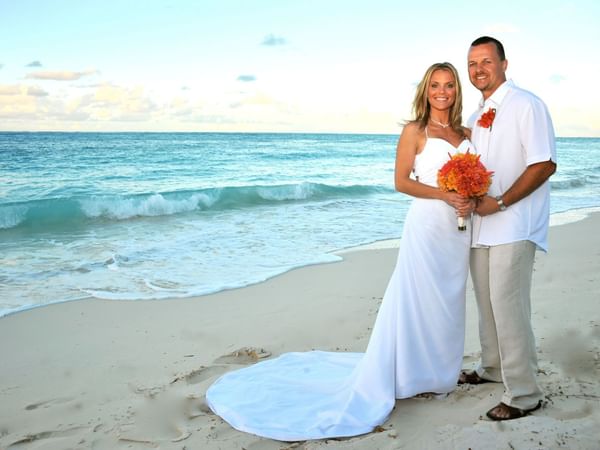 Wedded couple on the beach near Windsong Resort On The Reef