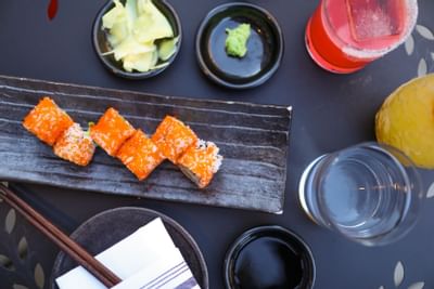 Closeup of sushi served with cocktails at The Eliot Hotel