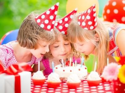 Kids blowing candles on cake at Artyzen Grand Lapa Hotel Macau
