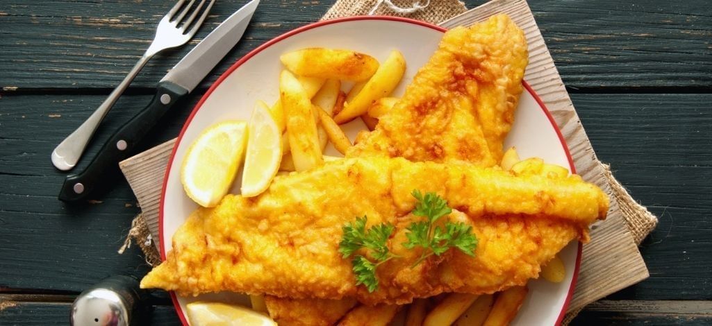 Fish and chips with lemon wedges