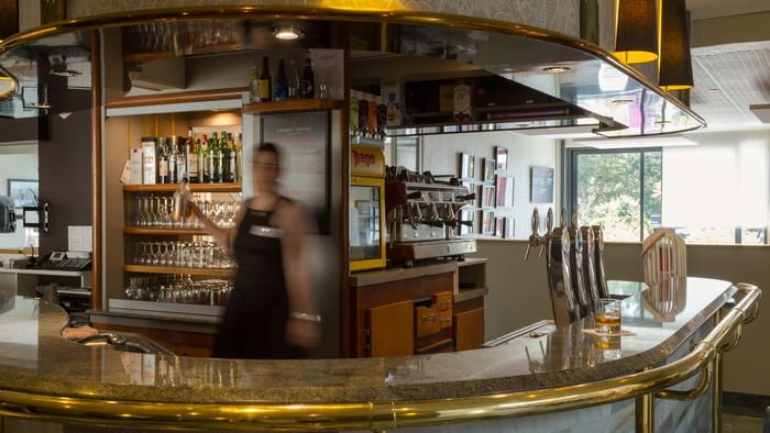 A bartender makes a cocktail at Hotel au chene vert